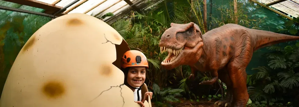 Child in dinosaur exhibit maui