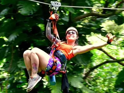 Rainforest Zipline on the Road to Hana: Zipline guide throwing shaka thumb