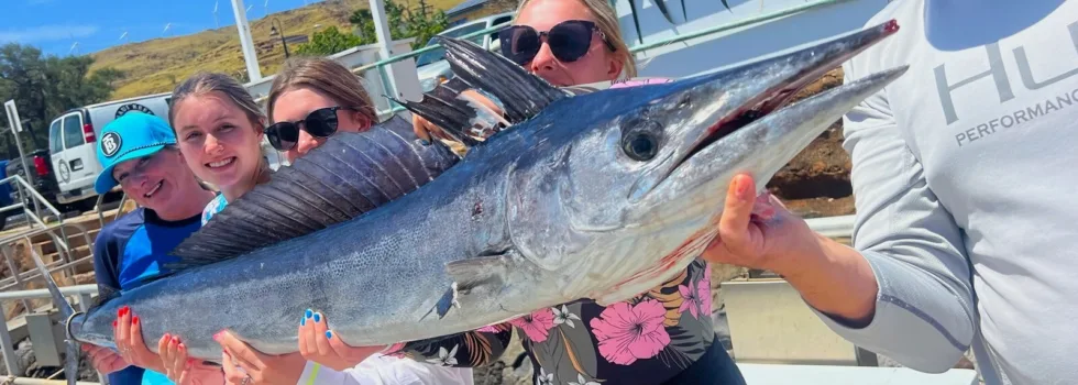 Showing off fish from maalaea dock