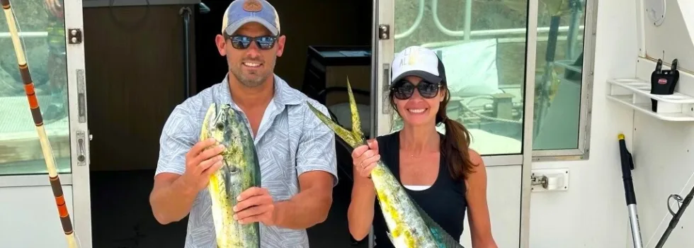 Happy couple catch fish maui