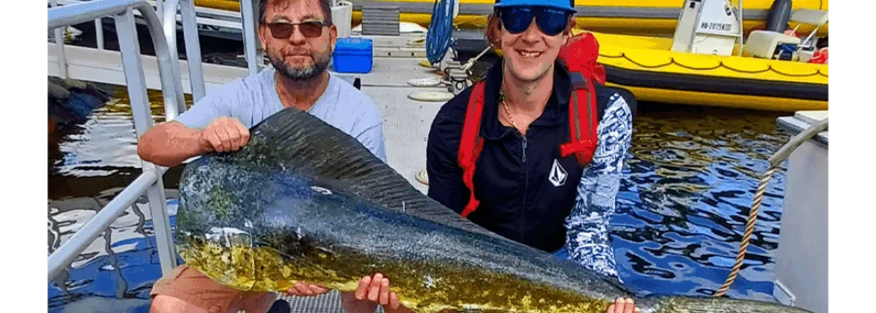 Couple displays fish from maui charter