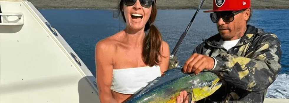 Woman catches mahimahi maui fishing charter