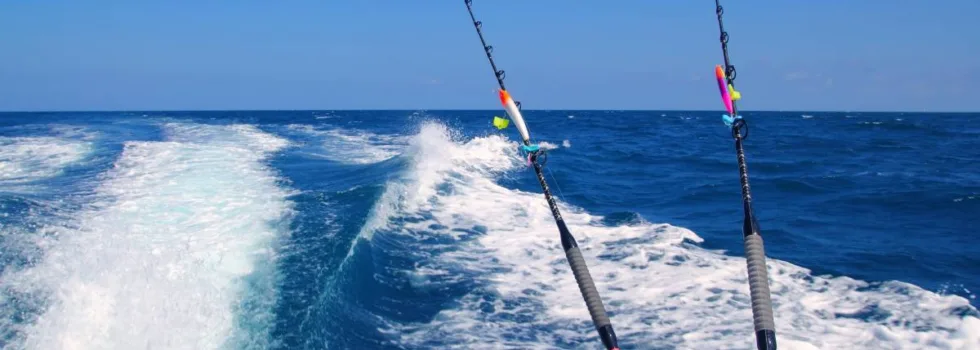 Fishing boat motoring off maui waters