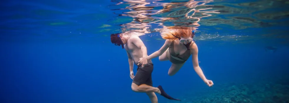 Snorkeling couple molokini