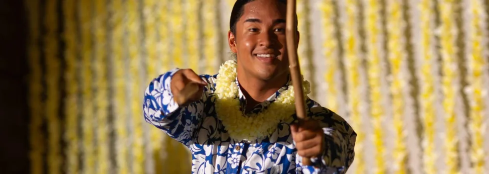 Male hula dancer with kalaau sticks
