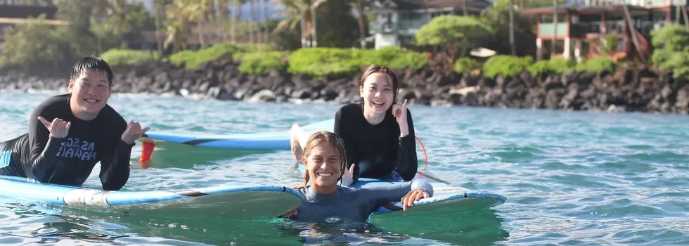 Happy surf students during lesson
