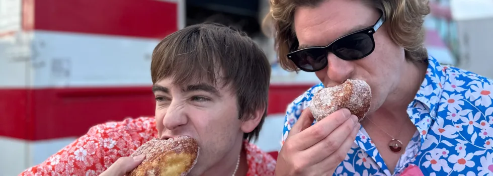 Leonards bakery boys eating malasada