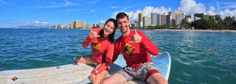 Cute couple taking surf lesson waikiki