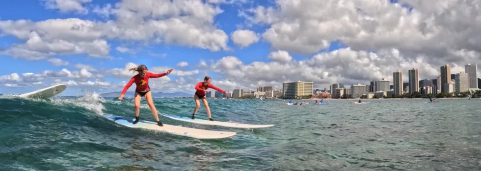Friends share wave waikiki