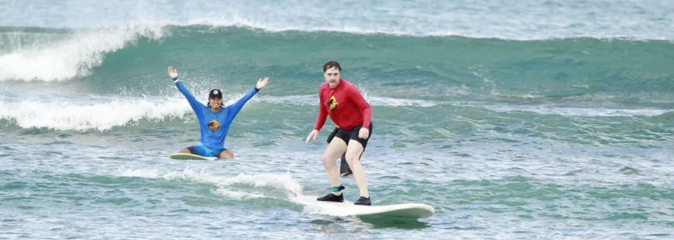 Man learns to surf in waikiki