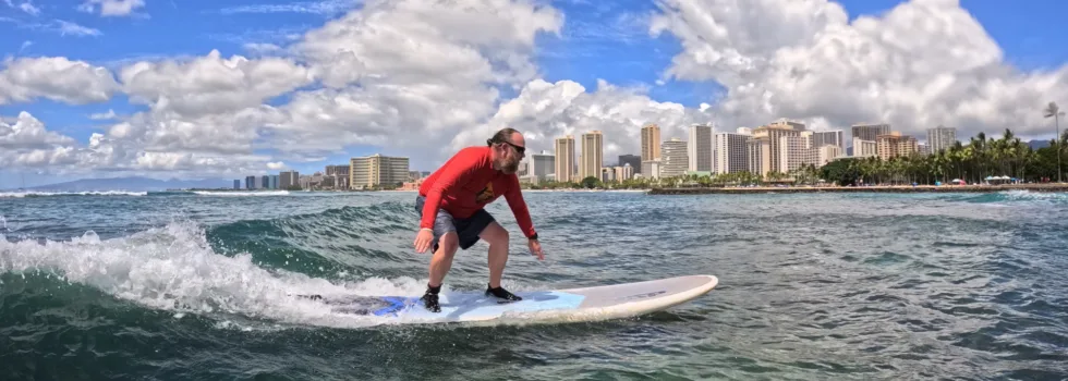 Man riding surf lesson wave waikiki