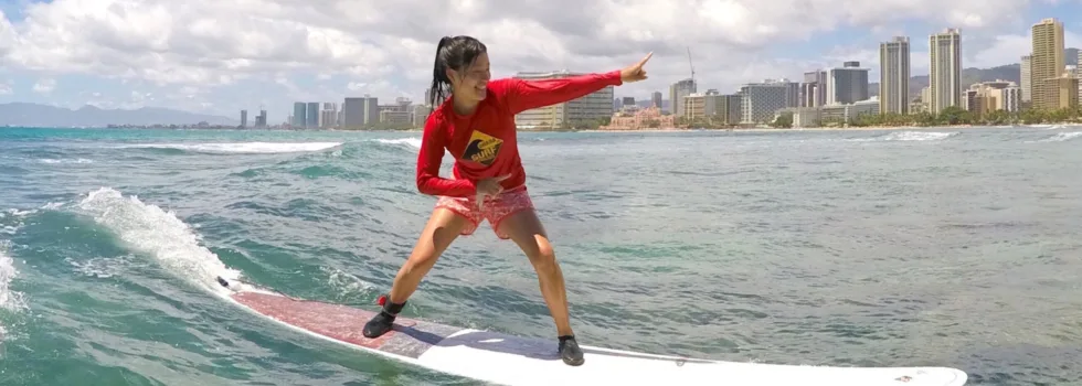 Surfing lesson in clear waikiki water