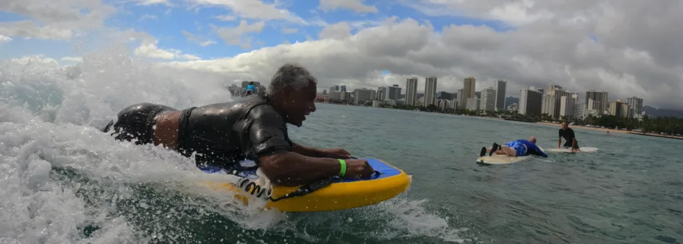 Older gentleman learns to boogie board waikiki