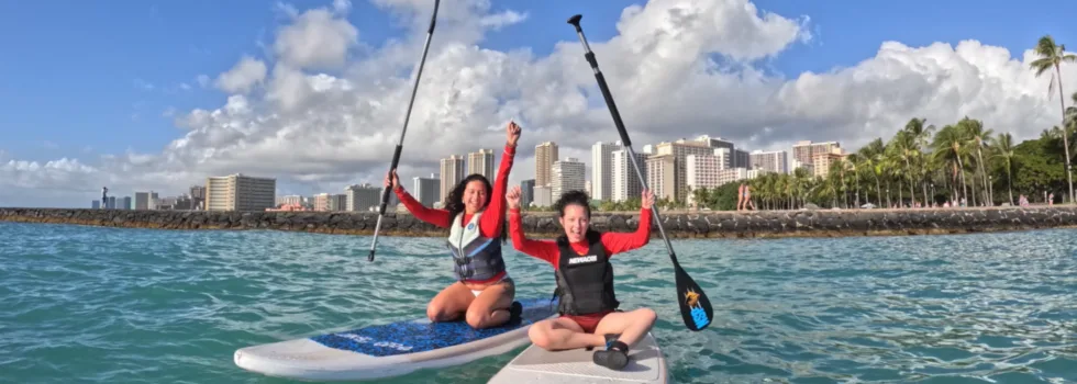 Friends celebrate stand up paddle