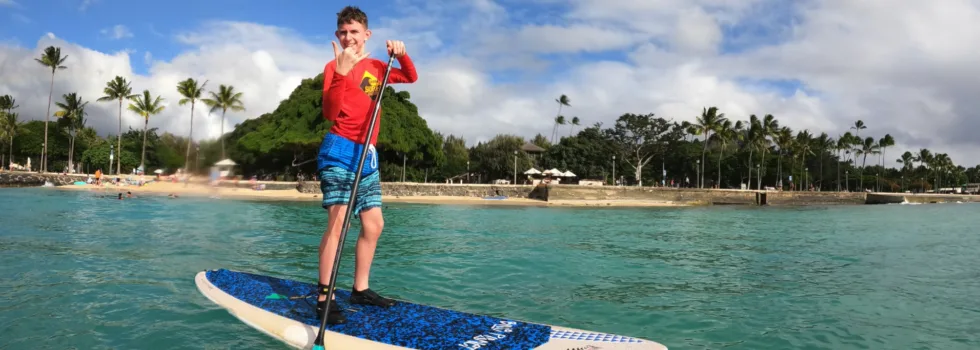 Happy kid sup in waikiki