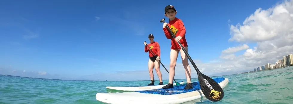 Little girl tries sup in waikiki