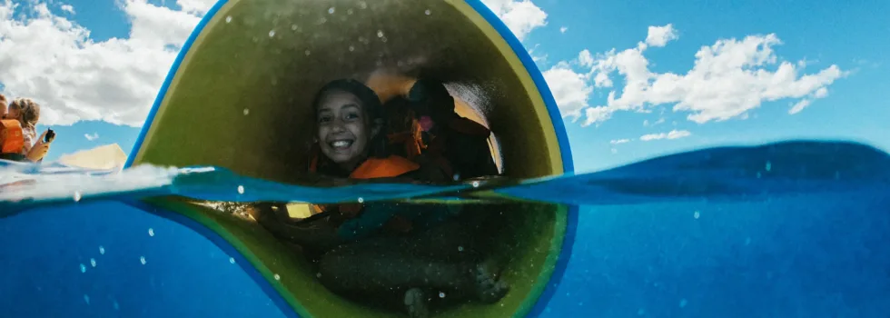 Kids rolled up in floating mat