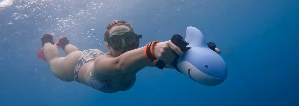 Snorkeler with shark scooter