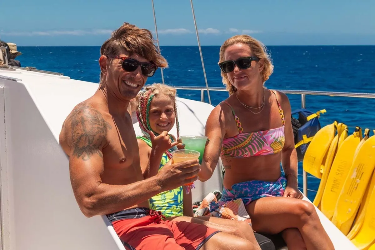 Family enjoying drinks and snack post snorkeling with sea turtles outside Waikiki