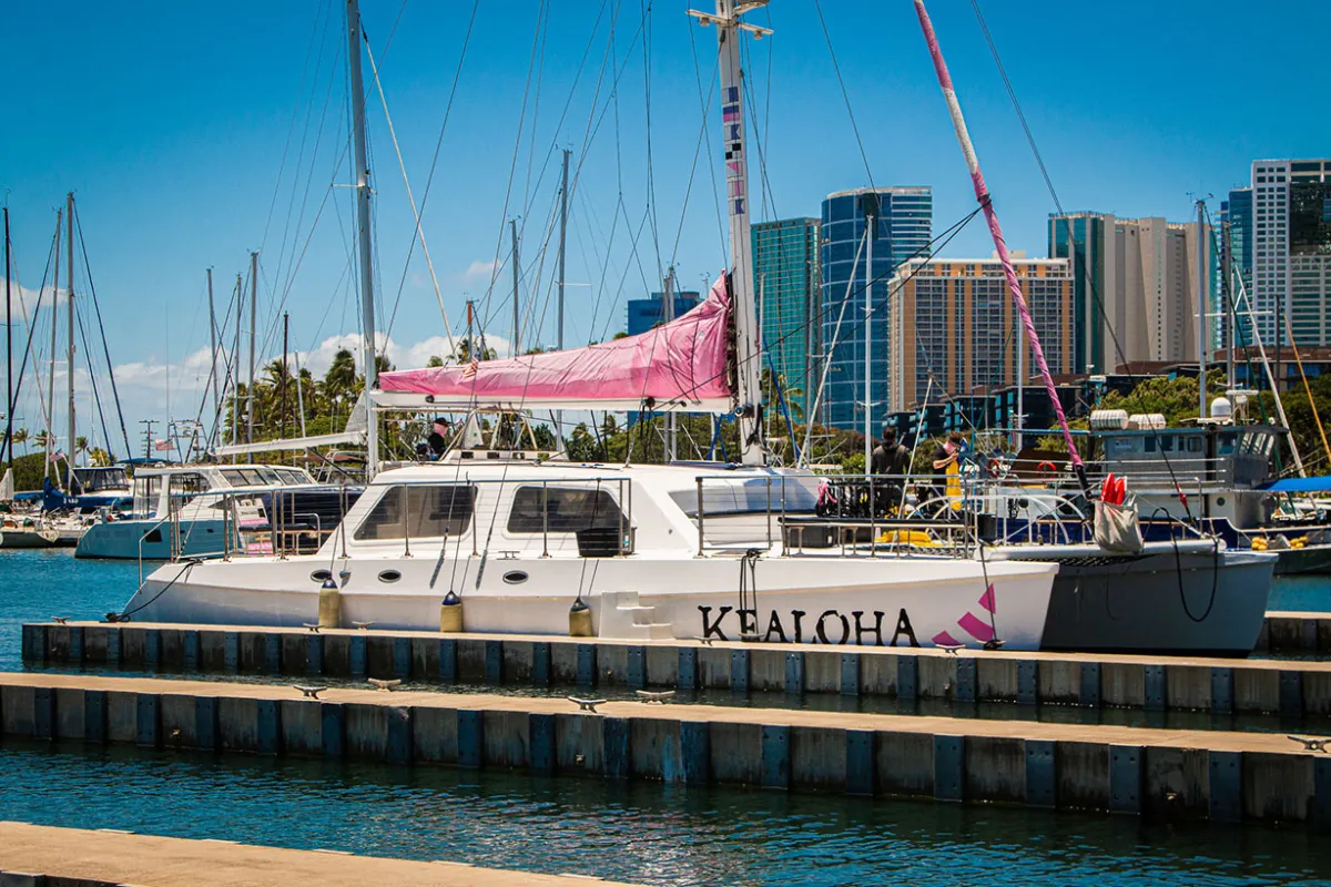 Catamaran sailing out from Waikiki harbor for snorkeling adventure