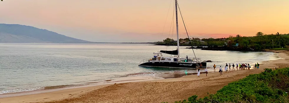 Maui beach loading catamaran hawaii