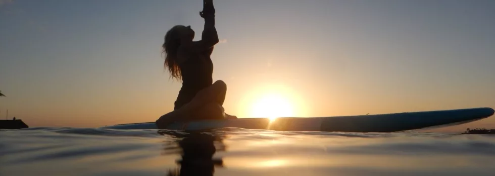 Silloutte of sunset yoga SUP waikiki